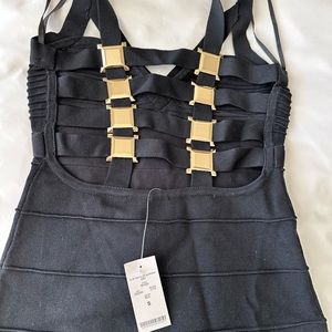 New with tags, black bandage, Bebe dress with gold detailing on the back